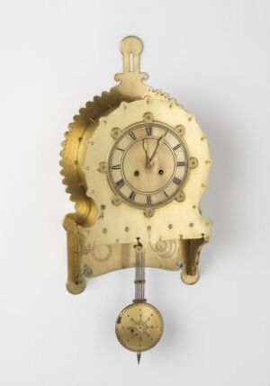  An antique golden brass pendulum clock mechanism with intricate designs and a small round clock face in the center, set against a neutral background.