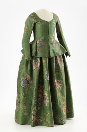  A historical green dress with ornate gold and dark green floral patterns, featuring a square neckline with white accent, long flared sleeves, and a full skirt suggestive of 18th-century fashion.