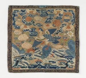  Square-shaped intricate textile featuring a border with a Greek key design in dark blue and gold, and a central area with mythical birds in shades of blue, cloud motifs, and floral patterns in muted oranges and browns.