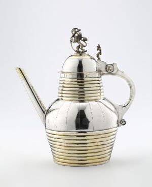  A silver teapot "Pipekanne" by Ole Moug, with a ribbed pattern body, smooth upper half, slender spout, and ornate handle, featuring engraving and partially gilt decoration on a light background.