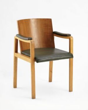  A mid-century modern armchair with a light-honey wooden frame and dark olive-green seat and armrest cushions, set against a light background. Artistname and title are unknown.