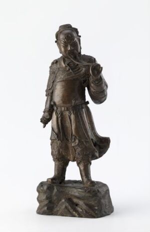  A bronze sculpture of a historical male figure in a dynamic pose with his right arm raised, wearing detailed period clothing and a cap, set against a plain white background.