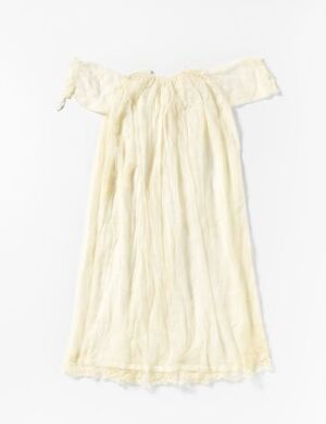  A vintage-style off-white dress with an off-shoulder neckline and a loose, flowing fit, made from a light, possibly semi-sheer fabric, presented against a simple pale background.