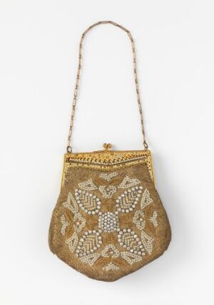  An antique-style teardrop-shaped purse with a camel or tan velvet background, embellished with symmetrical pearl and gold-tone metallic embroidery, featuring a gold metal frame and chain strap. Artist name and title are unknown.