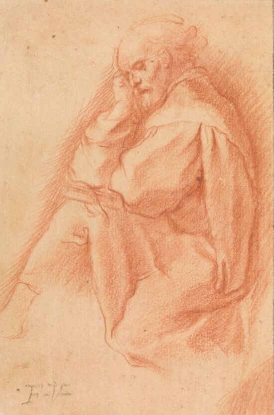 Sittende gammel mann med bok