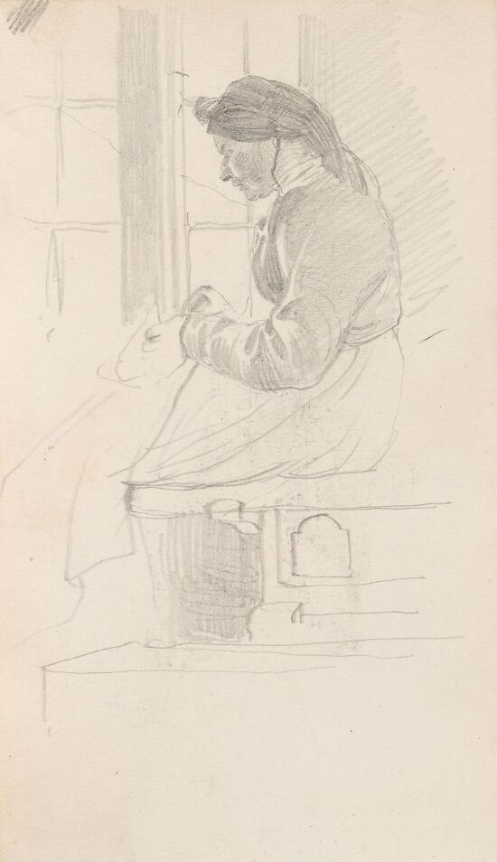 Kvinne som gjør håndarbeid ved vindu