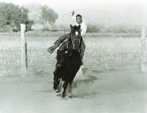 Jewel Roping a Calf