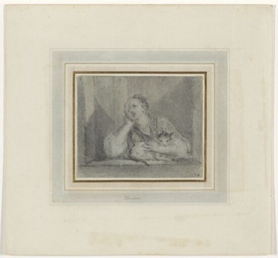 Ung kvinne med en katt i et vindu