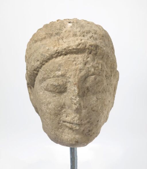 Head of male statuette