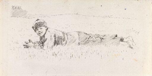 Gutt som ligger i gresset